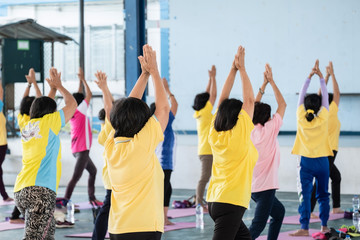 Elderly in a yoga exercise posture