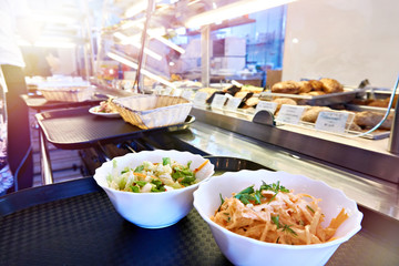 Vegetable salads on counter of public dining