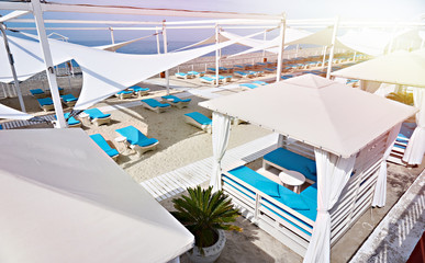 Sun beds on sandy beach