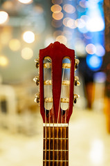 Guitar Headstock or Peghead with Blur Bokeh Background. Selective Focus.
