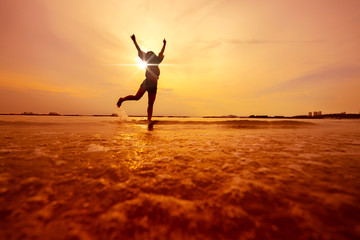 freedom asian beautiful woman  happiness jump and dance with sunset beach background © whyframeshot