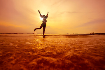 freedom asian beautiful woman  happiness jump and dance with sunset beach background