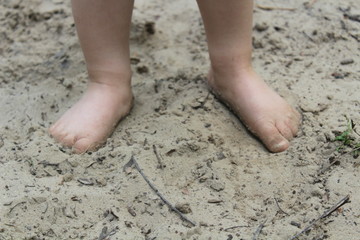 Child's feet on the sand 