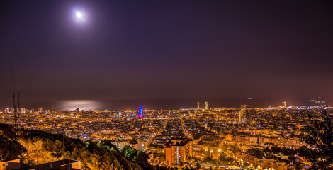 Barcelona skyline panorama at night from Turo Rovira, Catalonia, Spain.
