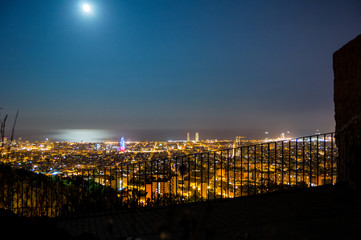 Barcelona skyline panorama at night from Turo Rovira, Catalonia, Spain.