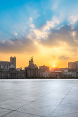 Fototapeta na wymiar Shanghai bund skyline and empty square floor at sunset
