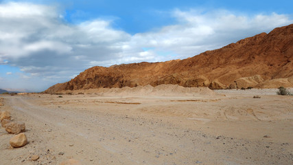 Fototapeta na wymiar White sandy road in desert