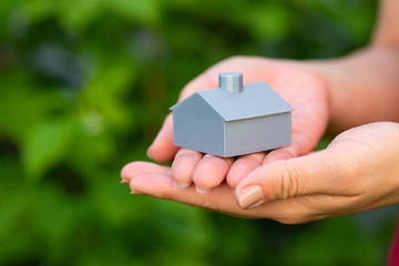 3d printed house in female hands