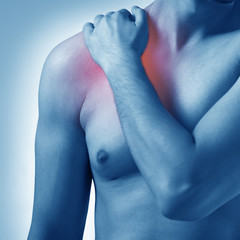 Man suffering from acute pain in shoulder