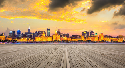Shanghai bund city skyline and wooden square at night,panoramic view