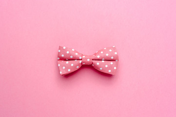 Bow-tie with polka dot on pink background