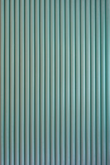 Striped background. Vertically structure of repeated green rolls