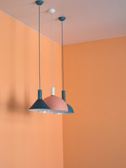 Pendant lights in orange interior. Orange room design with lights