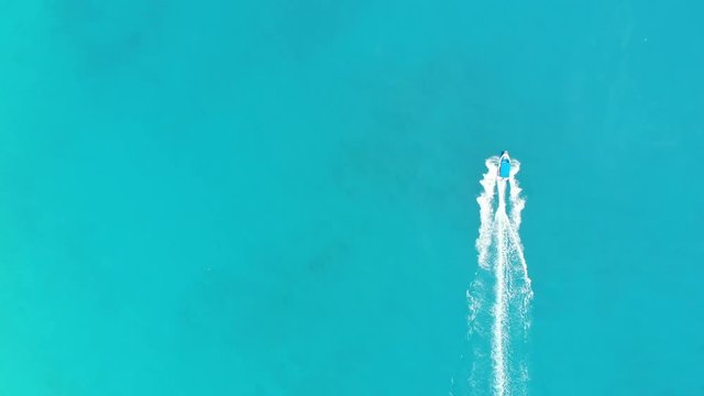 Aerial. Speedy boat sailing by sea. Top view, copy space. 