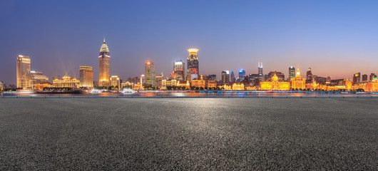 Fototapeta na wymiar Shanghai bund city skyline and empty asphalt road ground at night