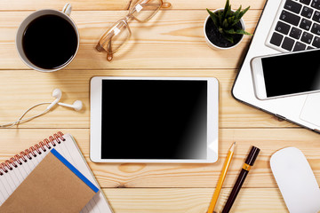 Working space. Laptop, notepad on wooden desk