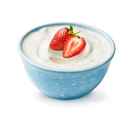 Blue bowl of yogurt with fresh beautiful strawberries isolated on white background. Half and whole...