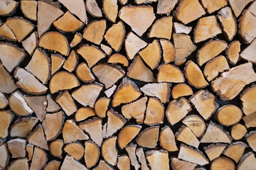 wall firewood, Background of dry chopped firewood logs in a pile