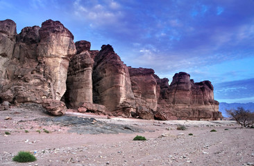 Jnique stone formation - pillars of the Solomon King in Timna geological park that is located 25 km north of Eilat (Israel), combines beautiful scenery with unique geology, variety of sport and family