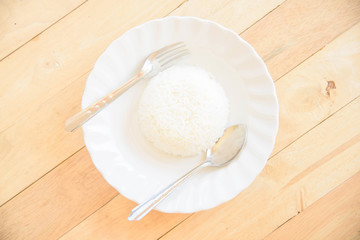 rice cooked in a dish on wood plate