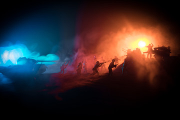 Obraz na płótnie Canvas War Concept. Military silhouettes fighting scene on war fog sky background,