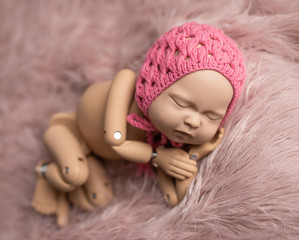 Mannequin of newborn for photo posing