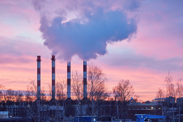 Pipes of a thermal power plant at dawn