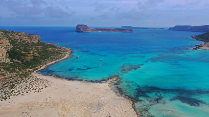 Aerial drone bird's eye view photo of tropical caribbean paradise bay and lagoon with white sandy beach and turquoise clear sea