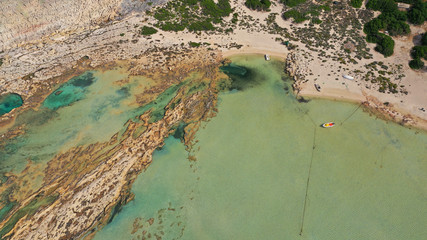 Aerial drone bird's eye view photo of tropical caribbean paradise bay and lagoon with white sandy beach and turquoise clear sea