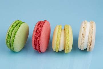 Colourful macaroons on a light blue background