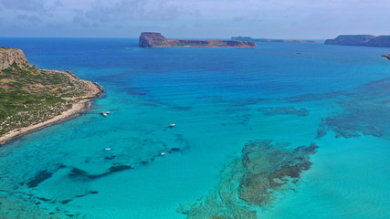 Aerial drone bird's eye view photo of tropical caribbean paradise bay and lagoon with white sandy beach and turquoise clear sea