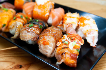 Fresh sushi rolls on black plate, Healthy and delicious traditional Asian menu