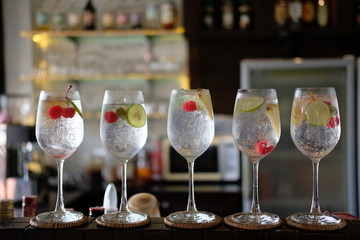 summer drinks of gin tonic alcoholic cocktails on table