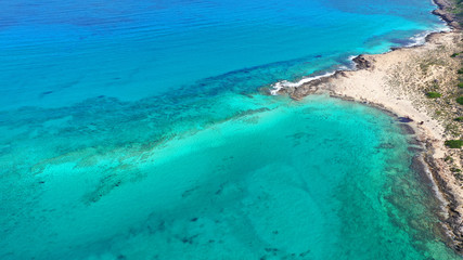 Aerial drone bird's eye view photo of tropical caribbean paradise bay and lagoon with white sandy beach and turquoise clear sea