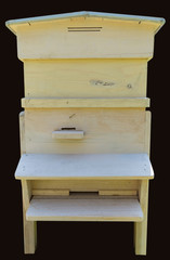 Wooden beehive for bees on honeycombs.