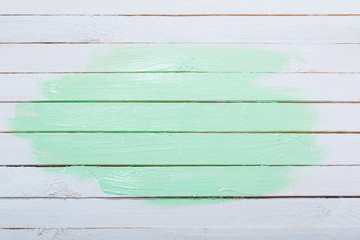 white and green painted wooden background
