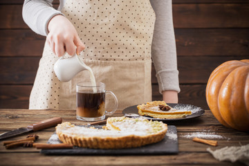woman with  cup of coffee and pumpkin pie