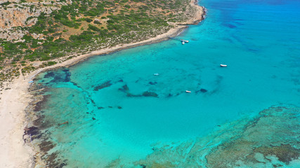 Aerial drone bird's eye view photo of tropical caribbean paradise bay and lagoon with white sandy beach and turquoise clear sea
