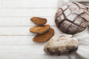 homemade bread on  white wooden background