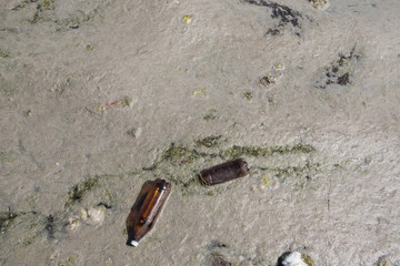Ecological catastrophy. Sea pollution by garbage. Plastic in the ocean. Plastic bags in the pond.