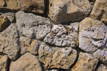 Stone wall. Background of stonework. The texture of the stone wall.