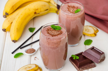 Chocolate banana milkshake (smoothie). Summer cold drink.