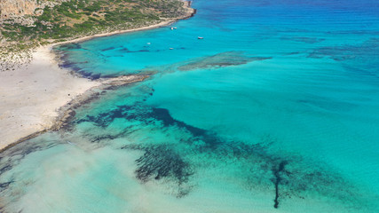 Obraz premium Aerial drone panoramic view of iconic azure turquoise Balos beach lagoon near Gramvousa island and pure white sand, North West Crete island, Greece