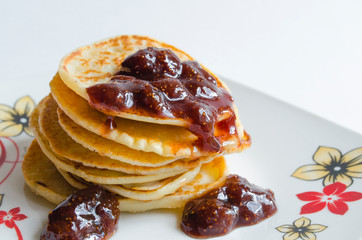 traditional Russian pancakes with berry jam. Shrovetide Maslenitsa Butter Week festival meal