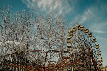 Old ferris wheel in the ghost town of Pripyat. Consequences of the accident at the Chernobil...