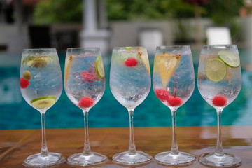 Summer drink at the pool background