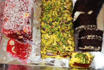 Rahat lakoum. Eastern sweets. Turkish sweets. Several types of Turkish Delight, including nuts.