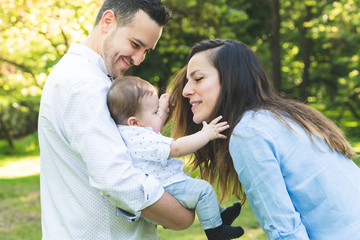 Obraz premium Happy Hispanic Family Having Fun Together Outdoors.