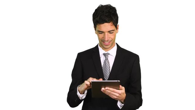 Portrait of a young businessman using a tablet computer