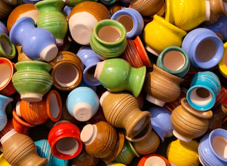 These are small earthenware jugs of different colors.